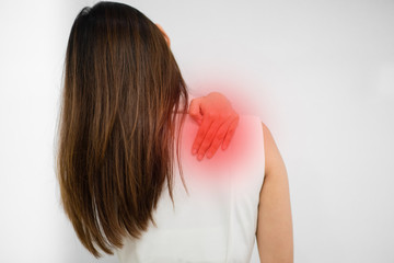 Back view of Asian woman having neck and shoulder pain.Office syndrome concept.