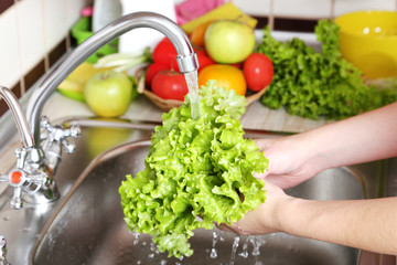 Vegetables washing in the kitchen
