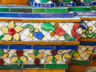 Close-up view of mosaic in the ancient Wat Arun Temple or The Temple of Dawn. Bangkok, Thailand