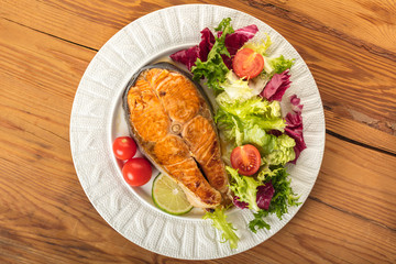 cooked steak salmon with vegetables