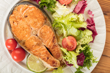cooked steak salmon with vegetables