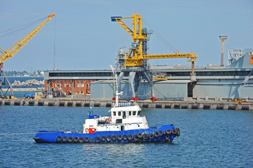 Tugboat and port cargo crane