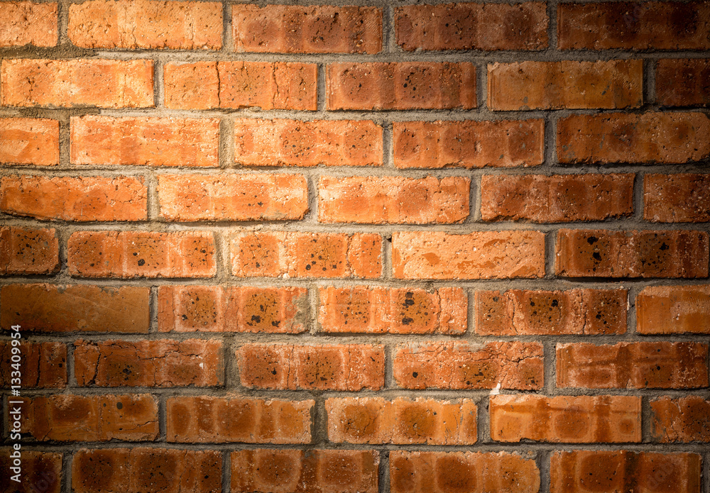 Wall mural close-up bright vintage bricks wall background.