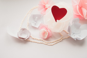 delicate paper flowers and red heart valentine's day