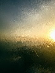 Fototapeta na wymiar Abstract blurry background condensation window