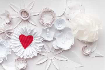 white  paper flowers and red heart