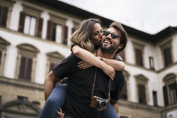 Young couple in love visiting the city of Florence in Italy
