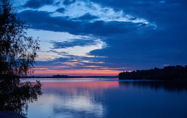 Landscape. Dawn over the broad river