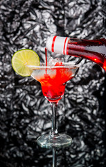 Alcoholic cocktail on the bar, close-up in glass