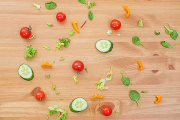 Organic food background of different fruits and vegetables on wooden table. Healthy eating concept.