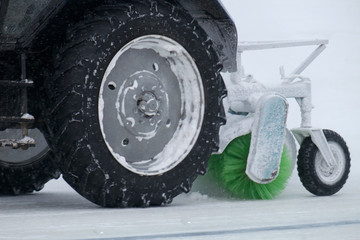 tractor cleans snow on the way