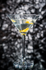 Alcoholic cocktail on the bar, close-up in glass