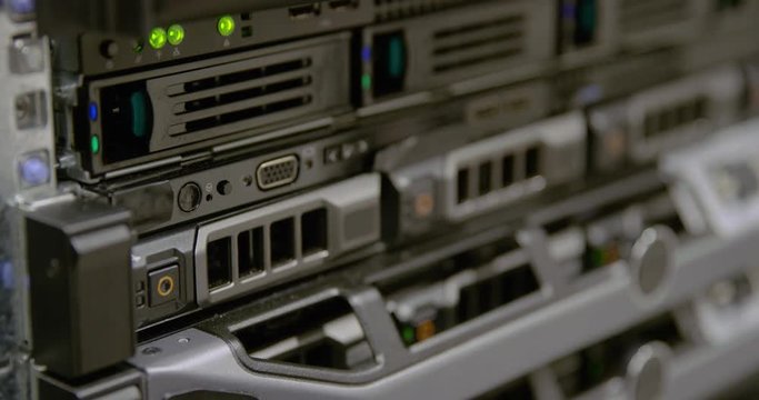IT consultant power on a rack server in datacenter