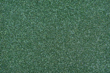 Glittery texture. Shining background. Green glitter