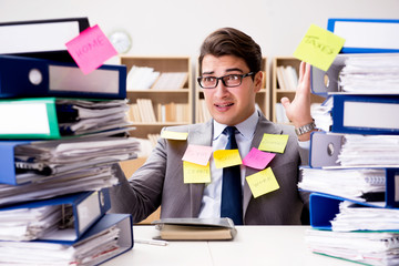 Businessman struggling with multiple priorities