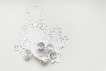 8 march, women`s day, a white napkin and white paper flowers