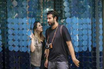 Young couple in love visiting the city of Florence in Italy