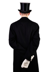 Mann mit schwarzen Hut, Zylinder und weißen Handschuhen von hinten isoliert weißer Hintergrund