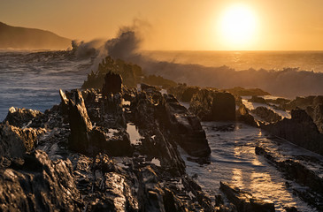 Jagged coast with crashing waves at Storm's River, South Africa