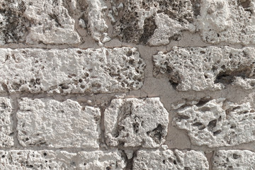 Old wall made of coquina stone