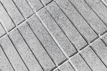 Gray concrete wall with rectangle relief pattern