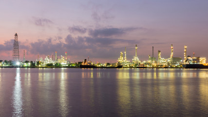 Panorama Oil refinery river front after sunset, industrial landscape background