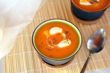 Pumpkin Creme Soup On A Bowl With Whipped Cream. Organic Vegetarian Food.