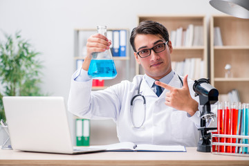Fototapeta premium Man doctor working in the lab