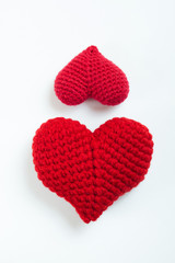 Crochet hearts on white background. Valentine's Day. Symbol of love.
