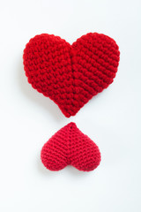 Crochet hearts on white background. Valentine's Day. Symbol of love.