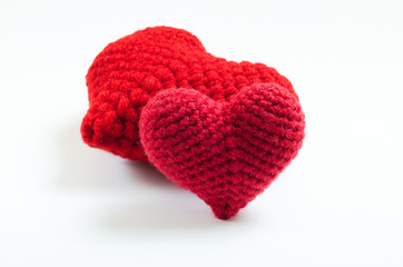 Crochet hearts on white background. Valentine's Day. Symbol of love.