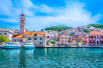 Fototapeta na wymiar Mediterranean coast town Pucisca. / Scenic view at mediterranean town on Island Brac, popular travel destination in Croatia, european summer resort.