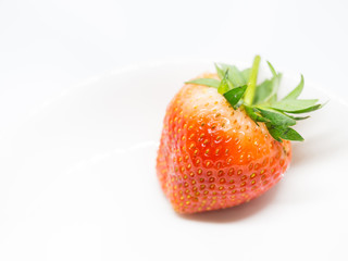 Closeup of fresh strawberry isolated on gray background