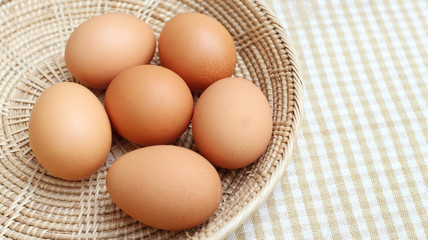 Close up Eggs Chicken on wooden basket 3