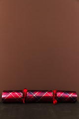 Tartan Christmas cracker with blank space above.