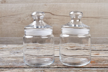 Modern empty glass jars with caps.