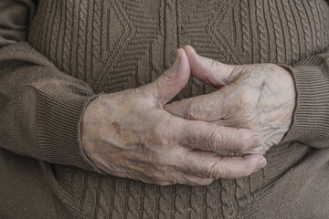 wrinkled hands of a senior person