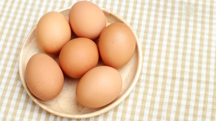 Close up Eggs Chicken on wooden plate 