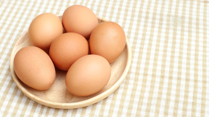 Close up Eggs Chicken on wooden plate 2