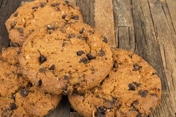 Oatmeal cookies on wooden background. Macro shot.