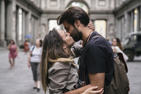 Young couple in love visiting the city of Florence in Italy