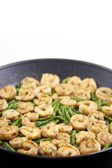 Fried Shrimp and asparagus in a pan.
