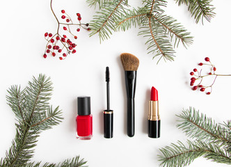 Winter cosmetics collage decorated with fir tree and berries on white background. Flat lay, top view