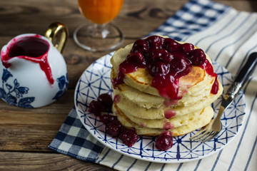 Delicious pancakes with cherry jam