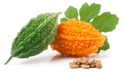 green and yellow bitter melon or momordica with leaf isolated on white background