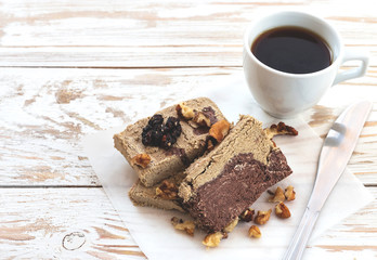 Marble sesame halva with cocoa and cup of coffee