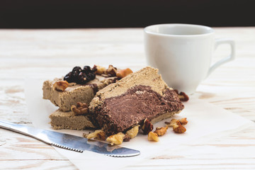 Marble sesame halva with cocoa and cup of coffee