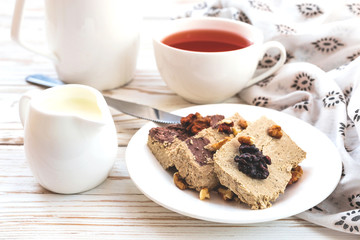 Marble sesame halva with cocoa and cup of tea