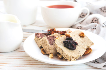Marble sesame halva with cocoa and cup of tea