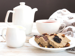 Marble sesame halva with cocoa and cup of tea